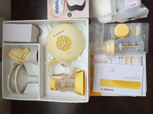 Молокоотсос Медела Medela sving