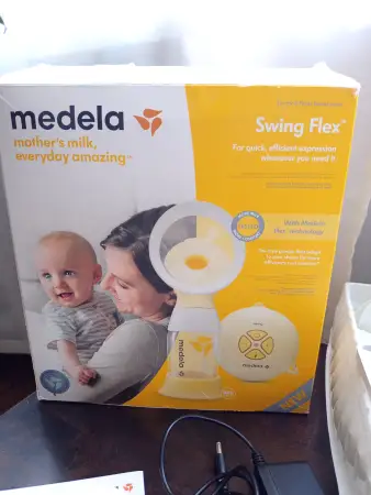 Молокоотсос Медела Medela sving